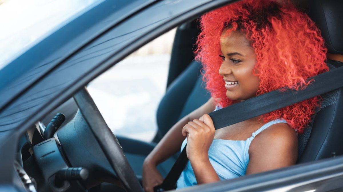 Portrait of afro woman preparing to drive